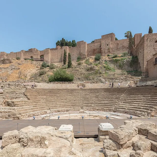 The Roman theatre of Málaga with the walls of the Alcazaba climbing the hill above it